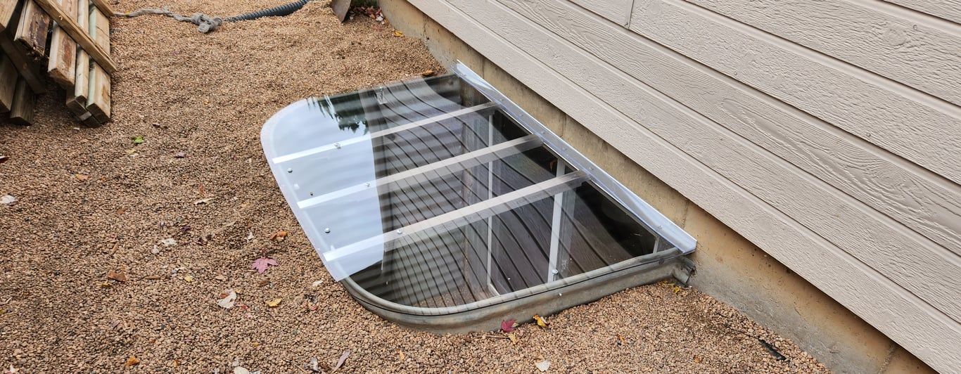 New metal window well installed in Algonquin Illinois replacing a deteriorated window well for safer basement protection