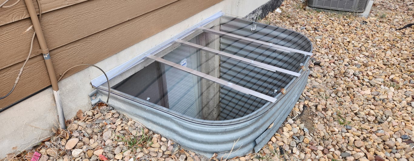 Transparent custom window well cover built on site in Cary Illinois for exact window well dimensions
