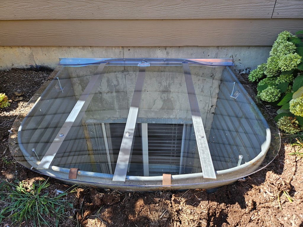 Crystal clear polycarbonate window well cover with locks 44x38 installed in Geneva Illinois