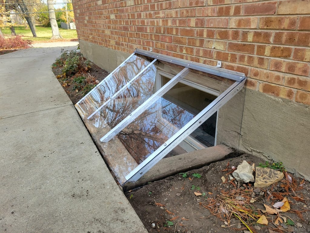 Slanted custom window well cover installed for improved water shed near Chesterton Indiana