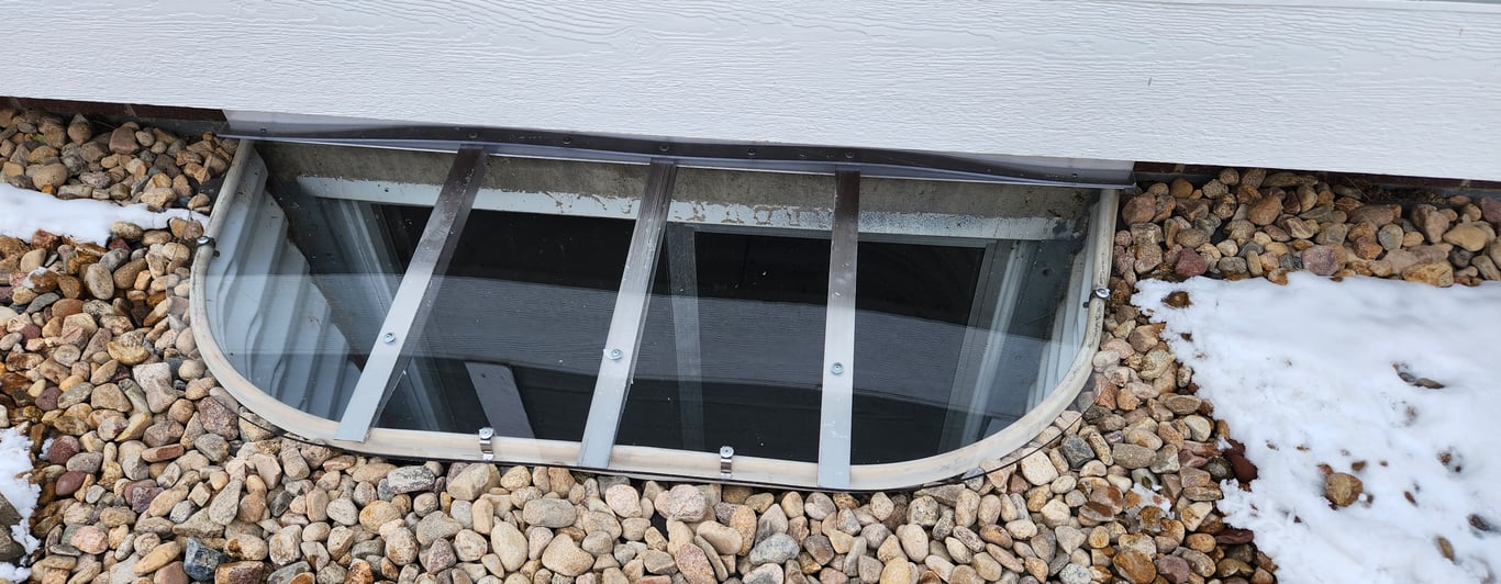 Custom clear polycarbonate window well cover built for exact dimensions in Brookfield Wisconsin