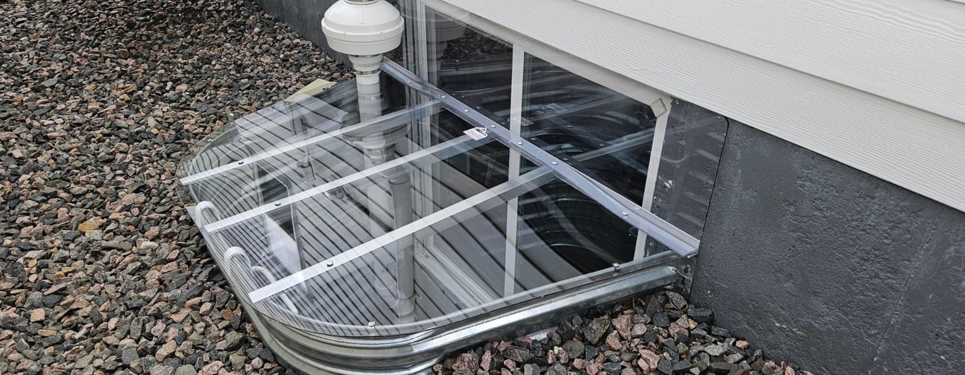 Custom clear window well cover with vertical extension and cutout installed in Harvey Illinois