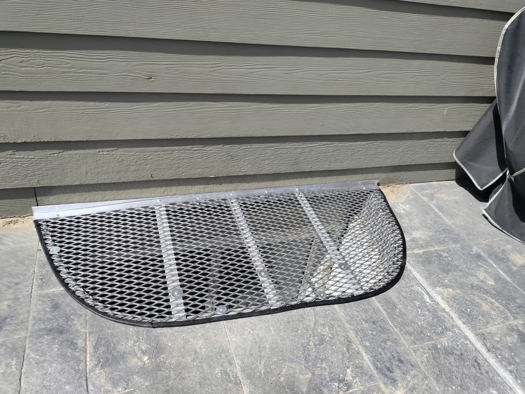 Egress aluminum window well grate installed on patio Oak Lawn Illinois