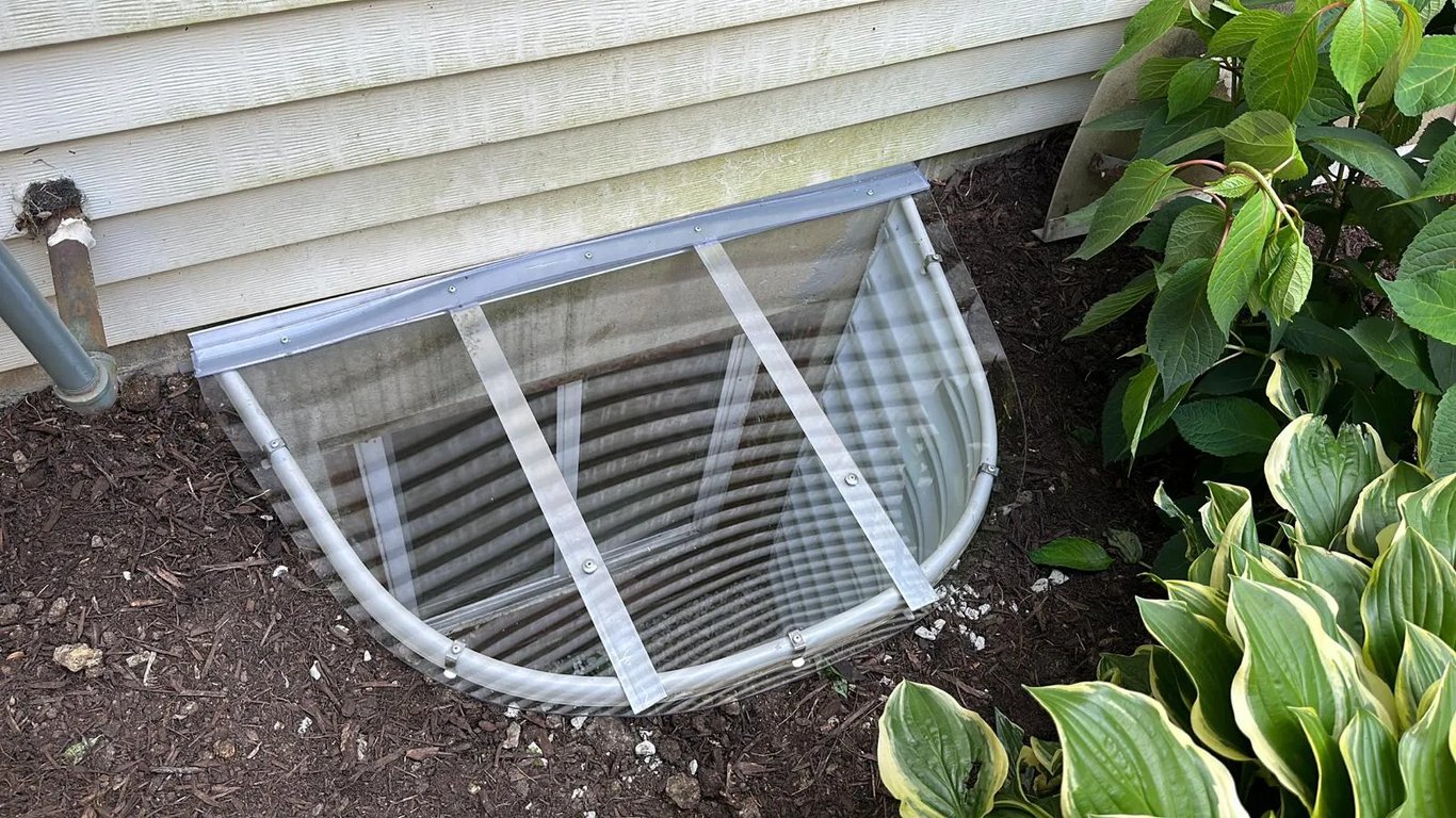 Sloped polycarbonate window well cover 42x25 installed in Burbank Illinois