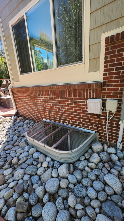 Durable transparent window well cover made from impact resistant polycarbonate installed in Bolingbrook Illinois