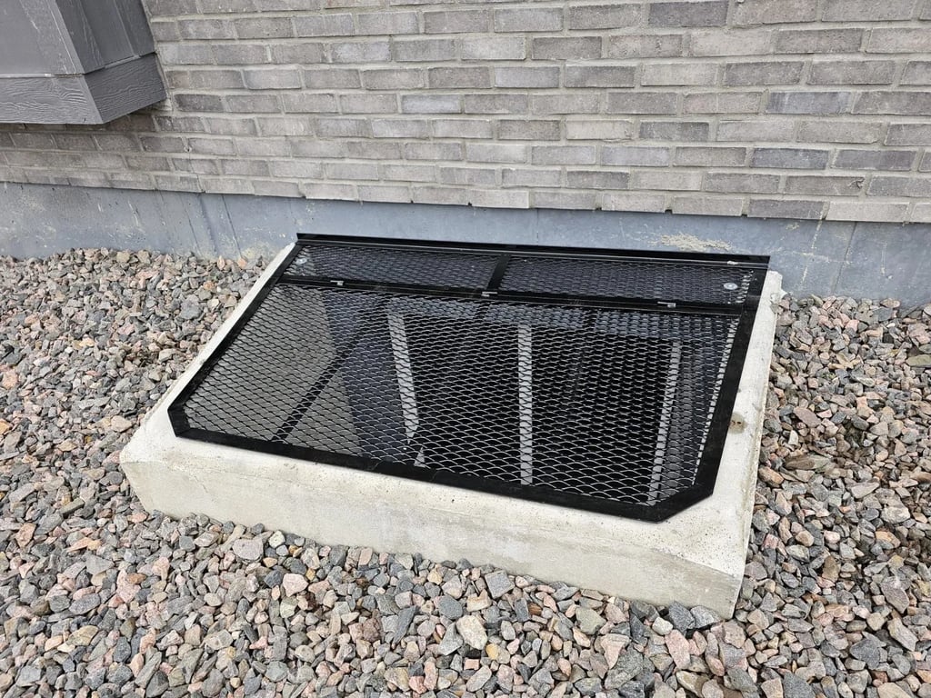 Custom powder coated metal window well cover installed in Ramah Colorado