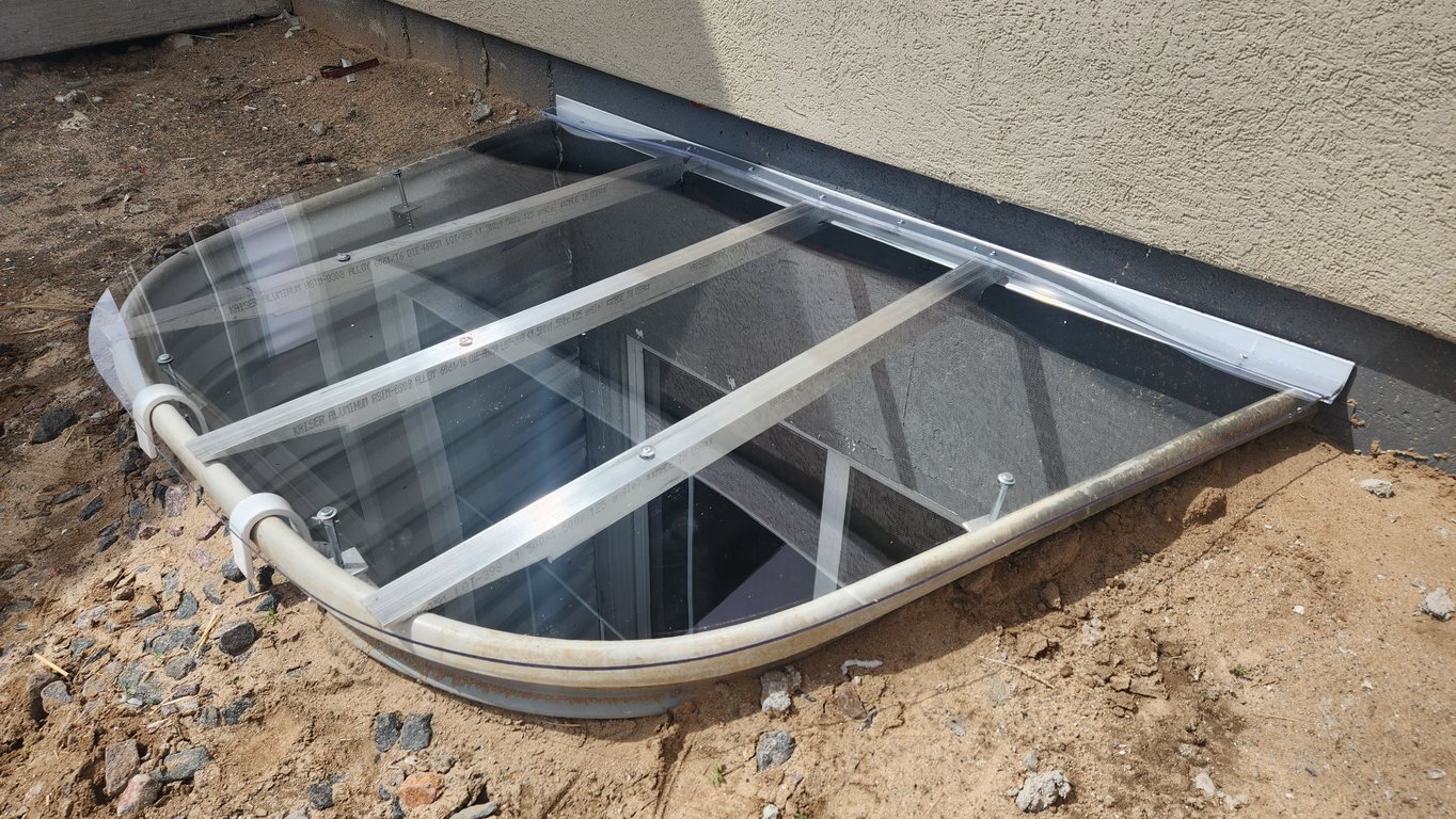 Durable transparent window well cover installed in Mokena Illinois built from impact resistant polycarbonate