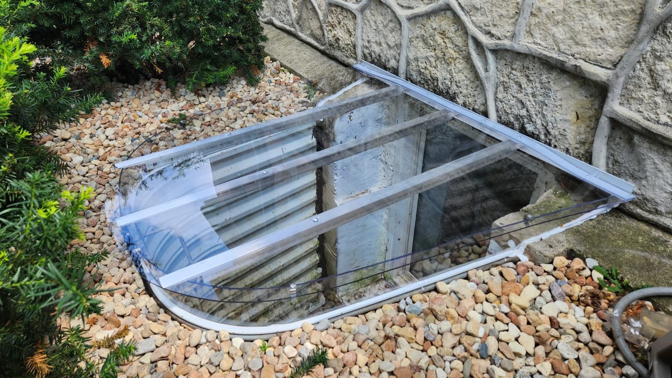 Window well cover with horizontal extension made of clear polycarbonate in Greenfield Wisconsin