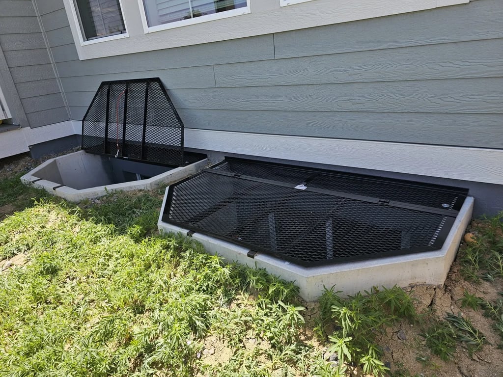75x45 powder coated metal window well cover with locks installed in Palmer Lake Colorado