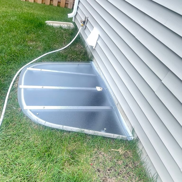 Privacy polycarbonate window well cover supporting up to 800 pounds installed in Montgomery Illinois