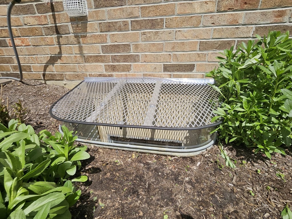 Custom aluminum grate with clear polycarbonate extension riser installed in Evergreen Park Illinois