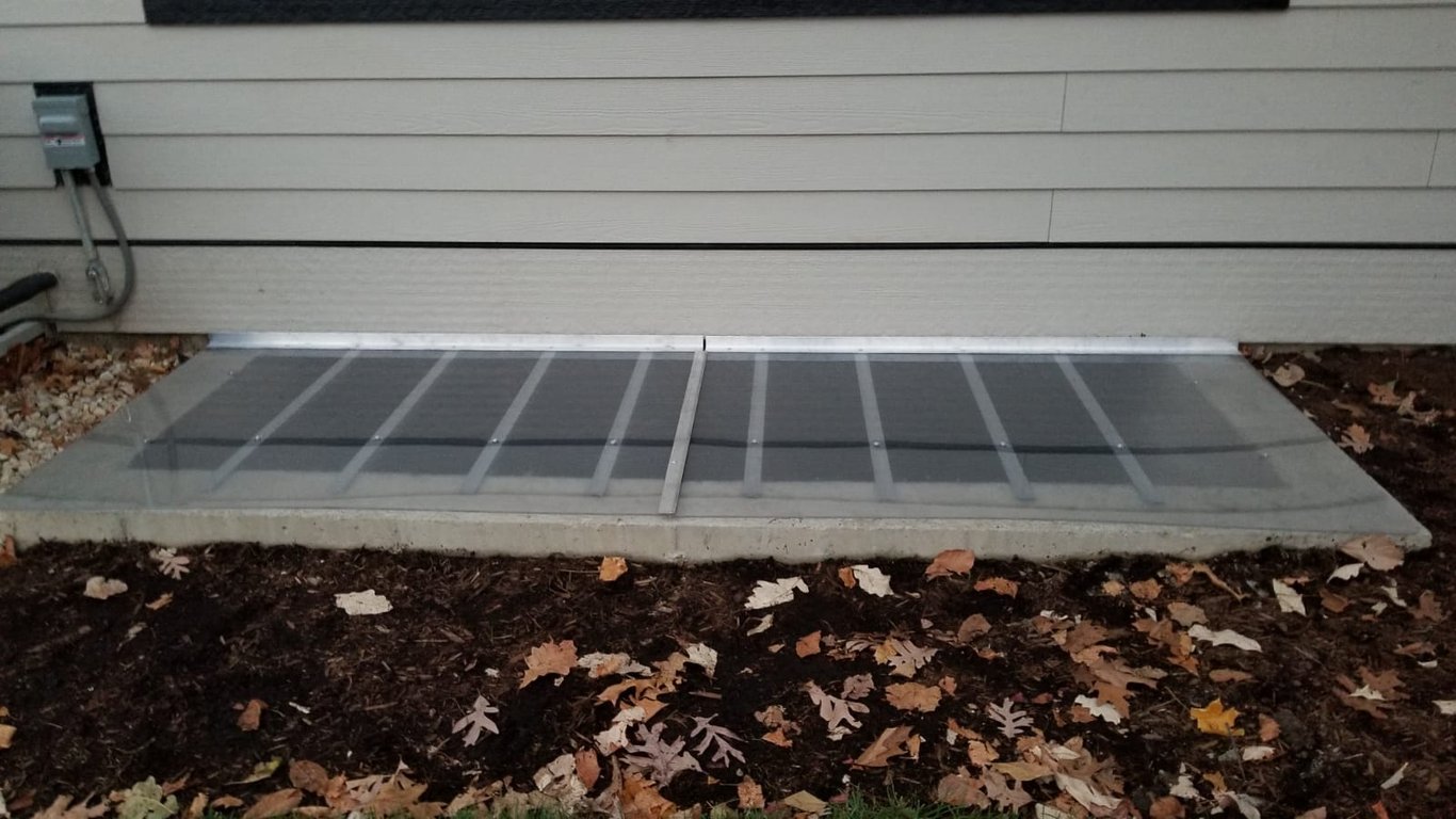 Oversize frosted polycarbonate window well cover installed in Buffalo Grove Illinois