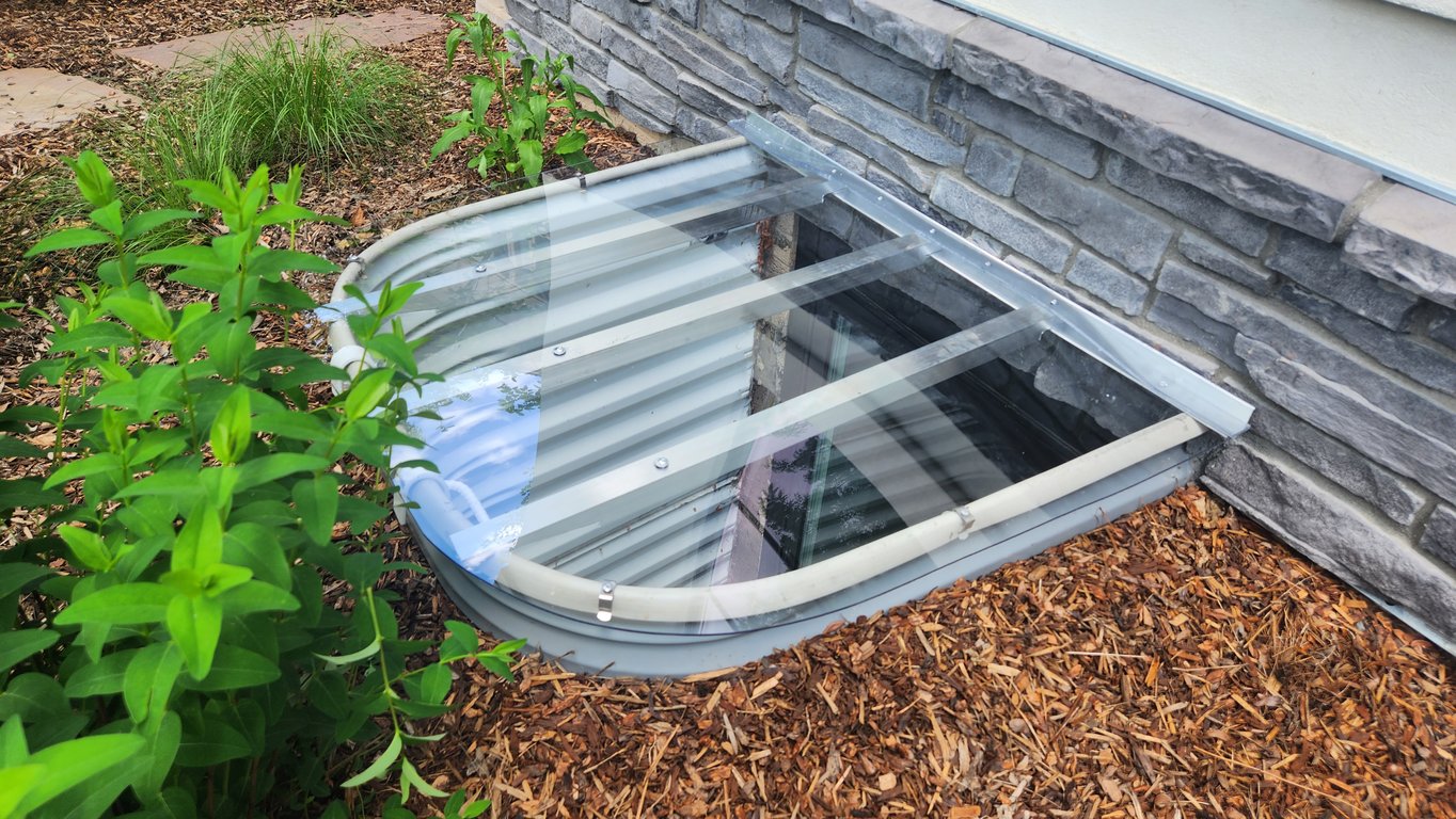 Egress window well cover installed with clips in Streamwood Illinois