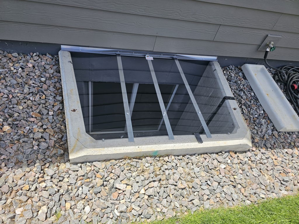 Strong clear polycarbonate custom window well cover installed in Louisville Colorado