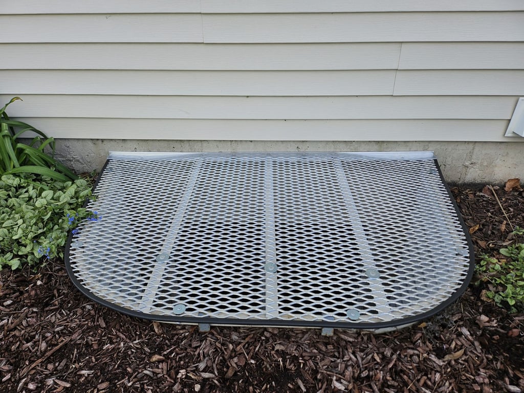 Custom ionized aluminum window well grate with locks installed in Oak Lawn Illinois