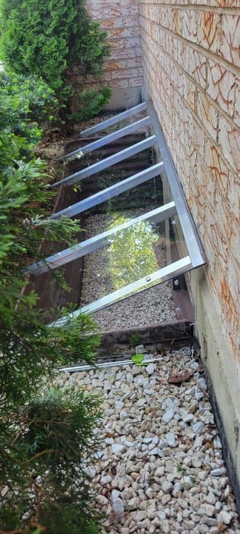 Slanted custom window well cover made of clear polycarbonate installed in Winfield Illinois