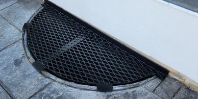Small 40x16 metal window well cover installed in Widefield Colorado