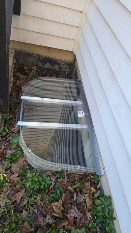 Clear polycarbonate basement cover custom fit on site in McHenry Illinois for exact window well dimensions