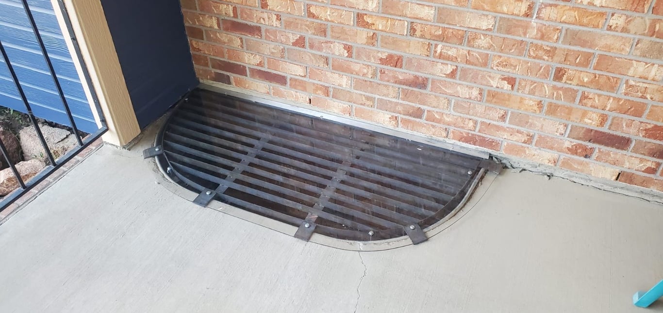 Overlay polycarbonate window well cover riveted to existing metal grate installed in Berwyn Illinois