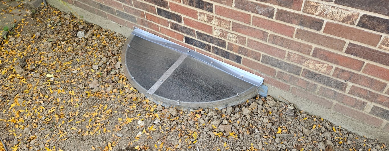 Frosted window well cover professionally installed in Naperville Illinois for long-term protection
