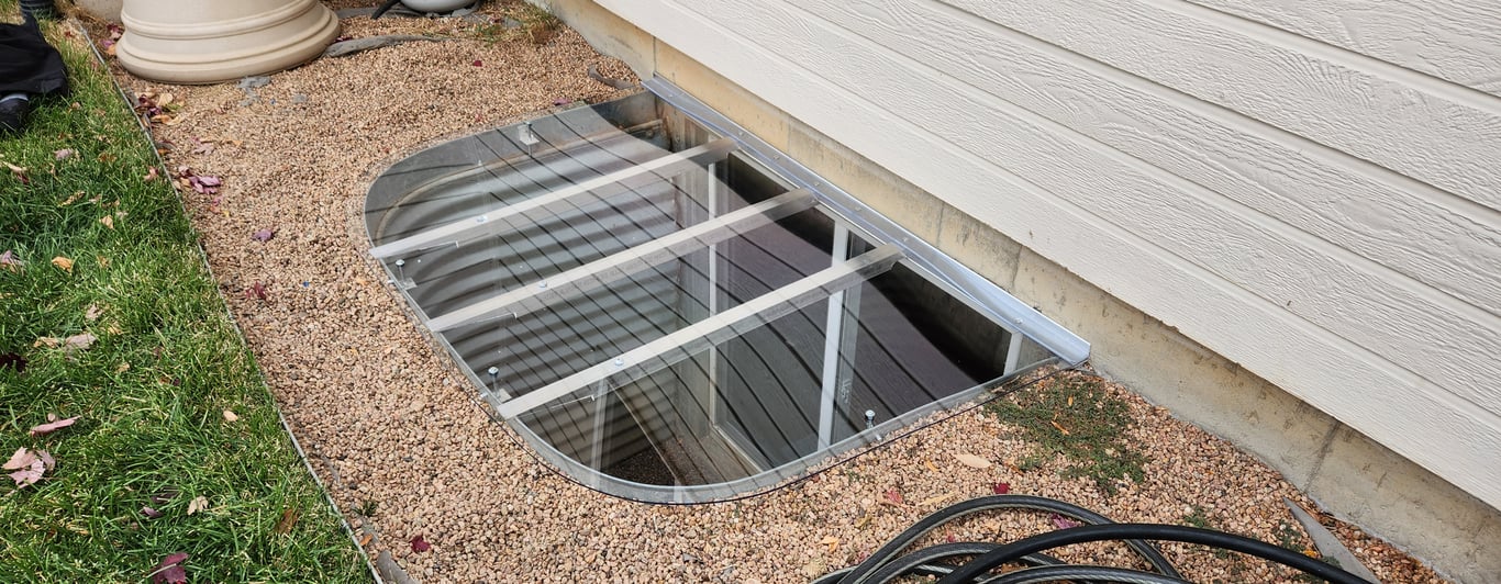 Custom window well cover installed in a backyard in Hoffman Estates Illinois