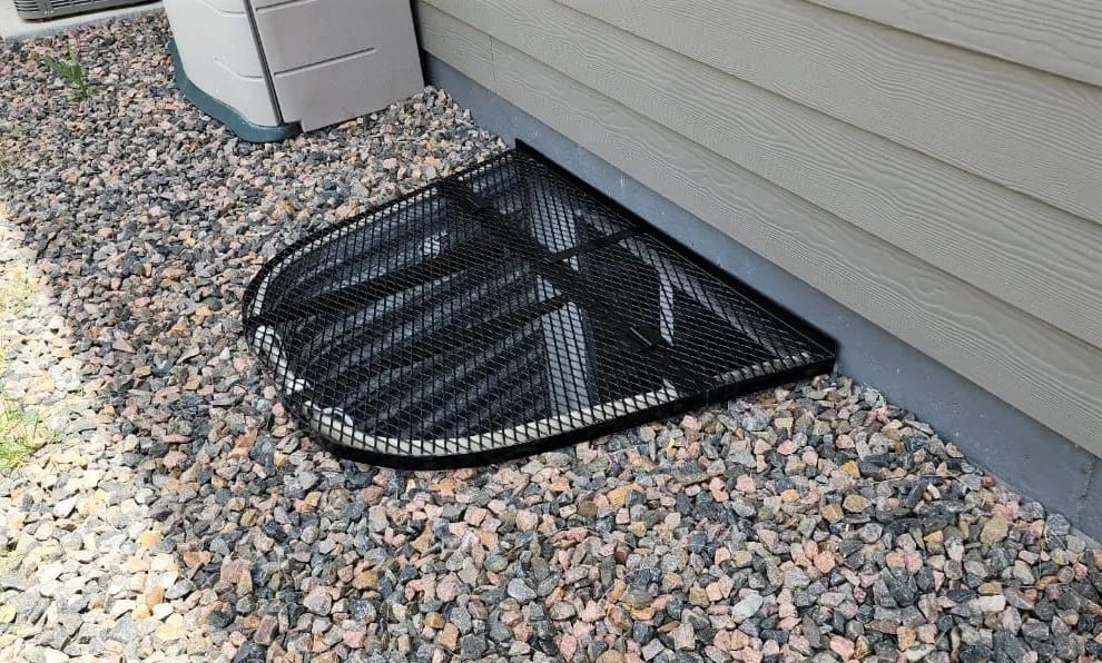 Powder-coated metal window well cover installed in Kenilworth Illinois