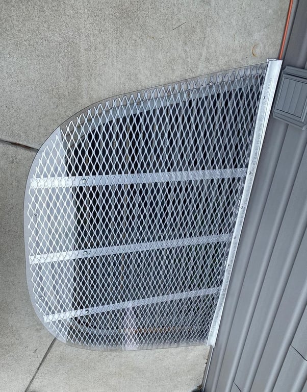 Custom aluminum grate with clear overlay window well cover installed in Alsip Illinois