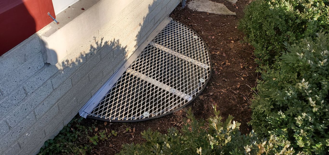 Aluminum metal window well grate with clips installed in Winfield Illinois