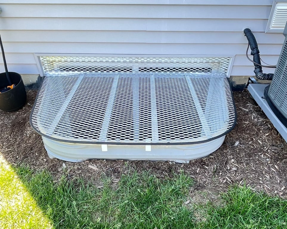Standard aluminum window well grate with ionized vertical extension installed in Evergreen Park Illinois