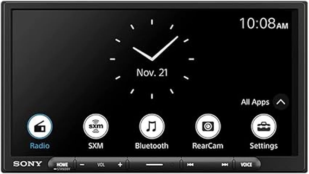 Sony in-dash touchscreen car stereo displaying a clean digital clock interface with app icons for radio, SiriusXM, Bluetooth audio, rear camera, and system settings.