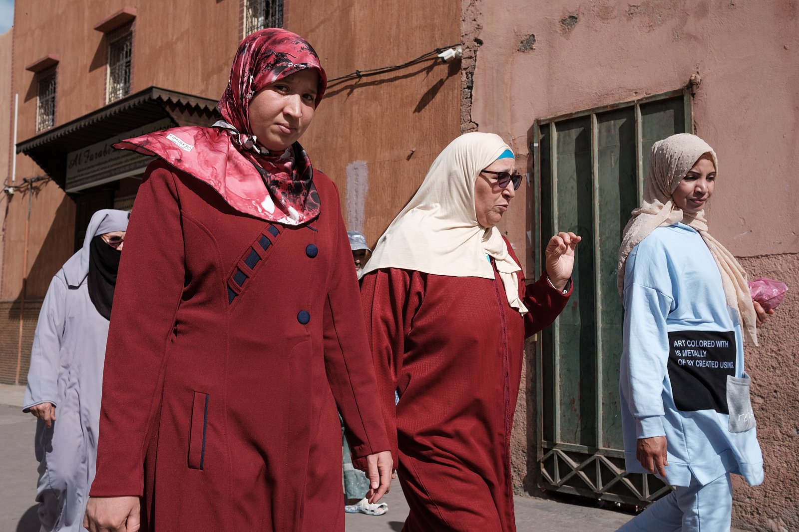 Three women walking past