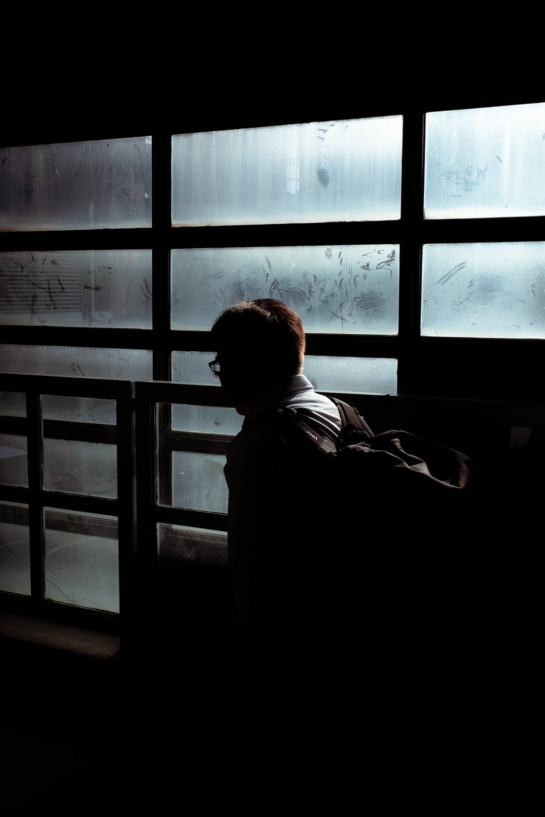 Silhouette of man with backpack