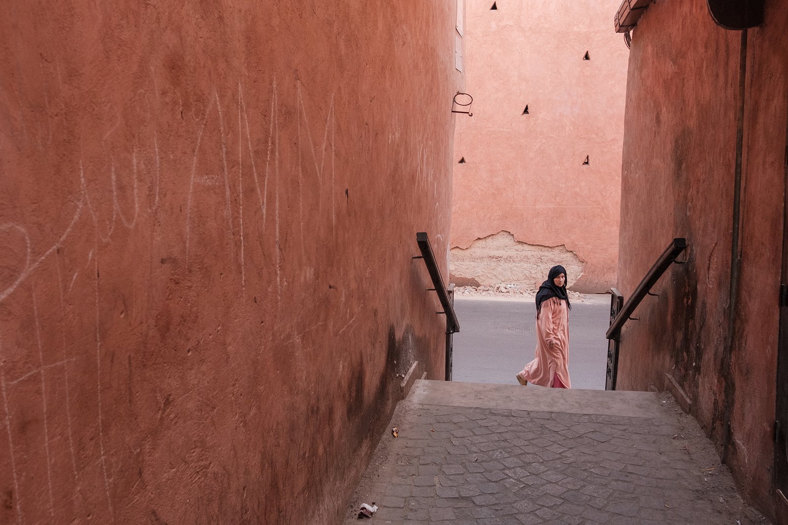 Woman at the bottom of stairwell