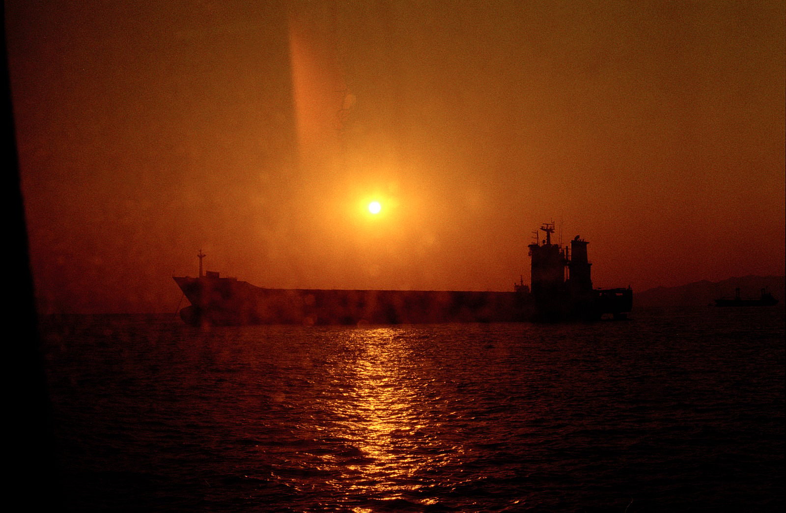 Sunset behind ship