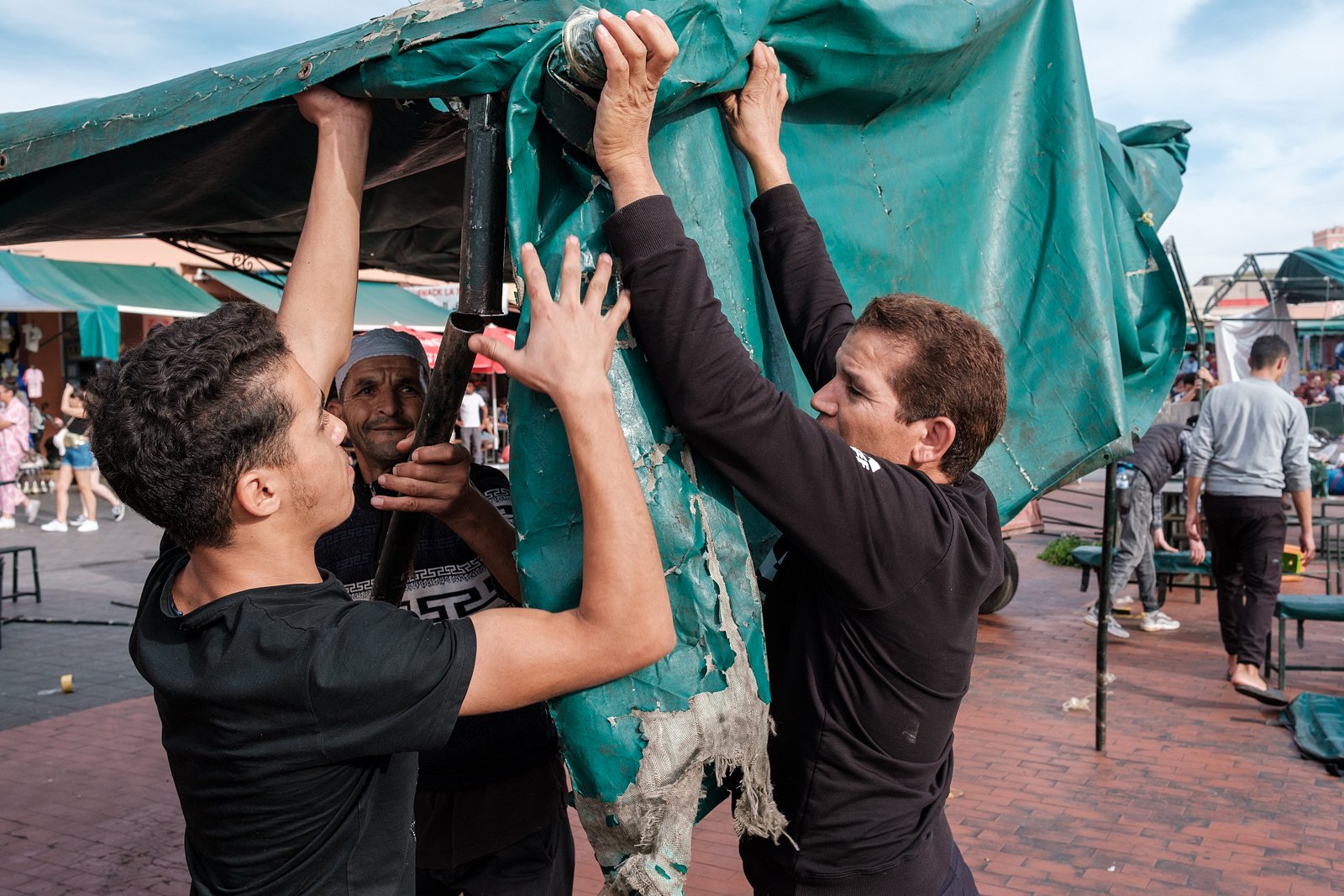 Men setting up canopy