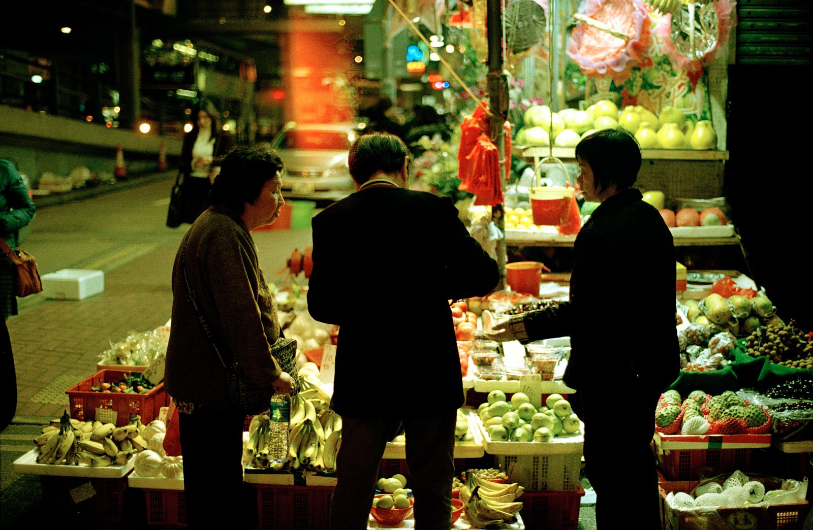 Man paying for shopping at night