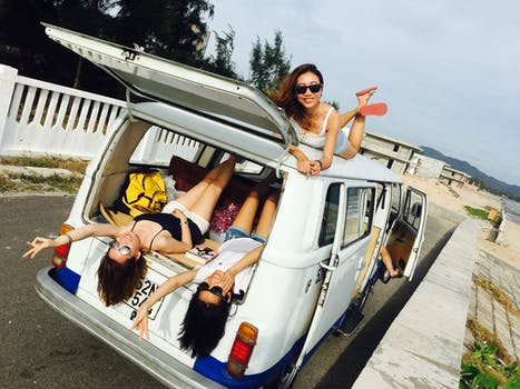 girls laying on mattress