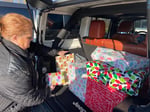 Image for Giving back: Gift deliveries brighten 100 children's Christmases