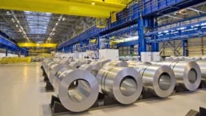 Large aluminum warehouse facility with steel rolls, representing a case study where switching to micro markets reduced downtime and HR service calls.