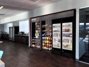 modern micro market breakroom solution, often featuring smart technology for employee convenience. 
