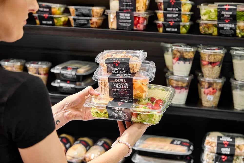 Employee browsing a smart cooler