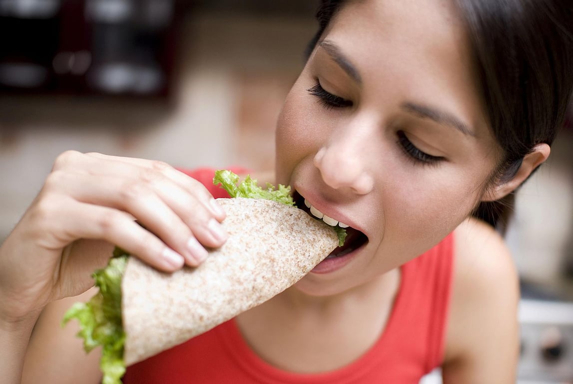 Woman Eating Wrap