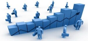 3D illustration of workers standing on rising bar graph steps with an upward trend line, symbolizing increased productivity from micro markets.
