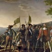 Painting depicting Christopher Columbus and his crew coming ashore in the New World, carrying banners and a Spanish royal standard, with ships anchored in the bay behind them.