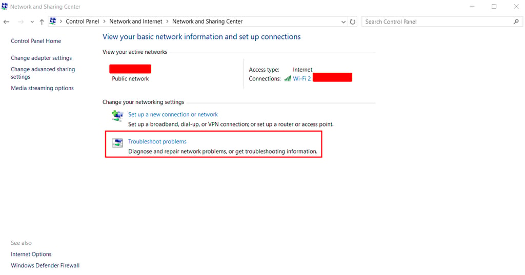 The Network and Sharing Center section on Windows, with Troubleshoot problems highlighted in red