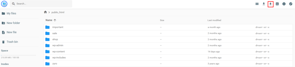 The public_html directory on hPanel with the Upload icon highlighted