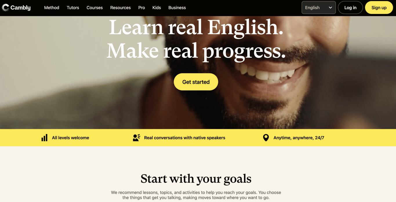 Homepage of Cambly, featuring the tagline "Learn real English. Make real progress." and a smiling person engaging with a device.