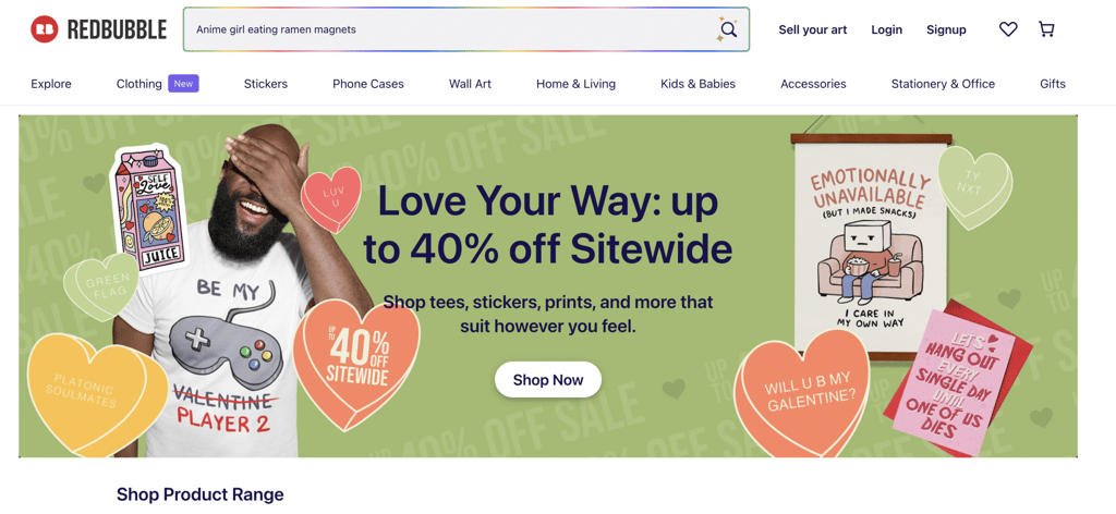 Redbubble homepage featuring fun and playful designs, including a gaming-themed shirt and various heart-shaped stickers.