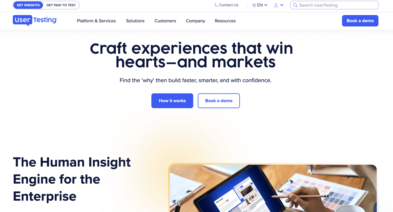 A UserTesting homepage featuring a tagline about crafting winning experiences and a visual of a person using a tablet.