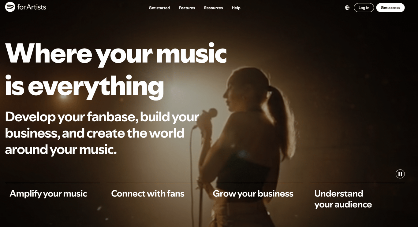 A singer performs on stage with dramatic lighting, promoting Spotify for Artists and its features for musicians.